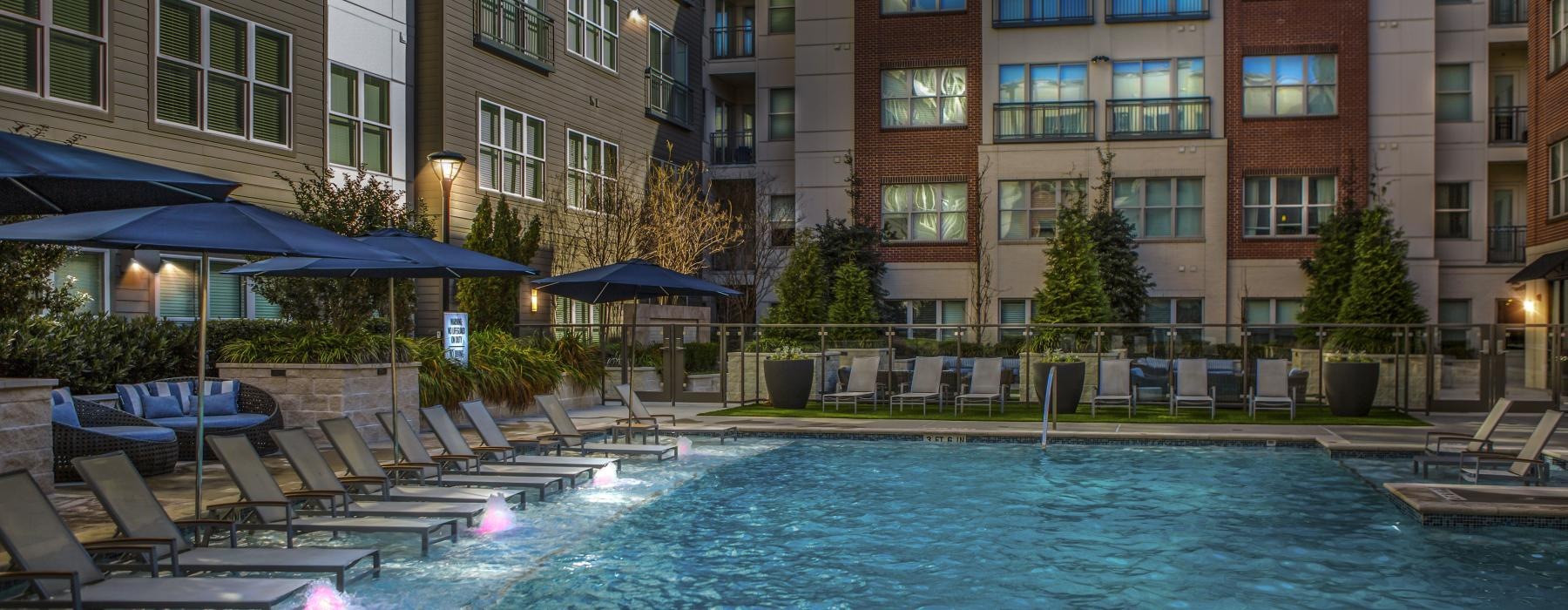 a pool in a courtyard between buildings