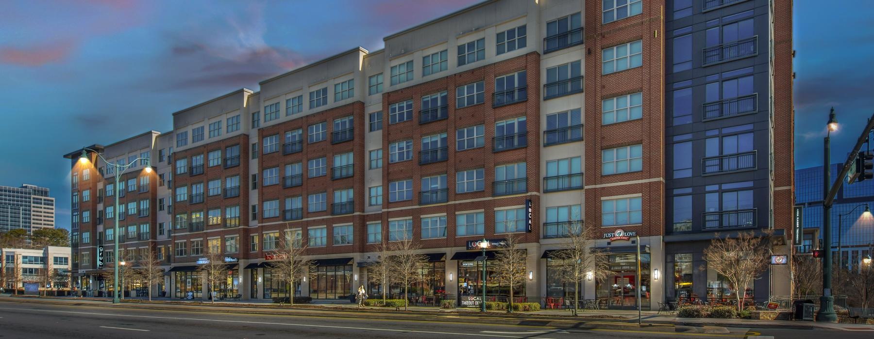 a large building with a street in front of it