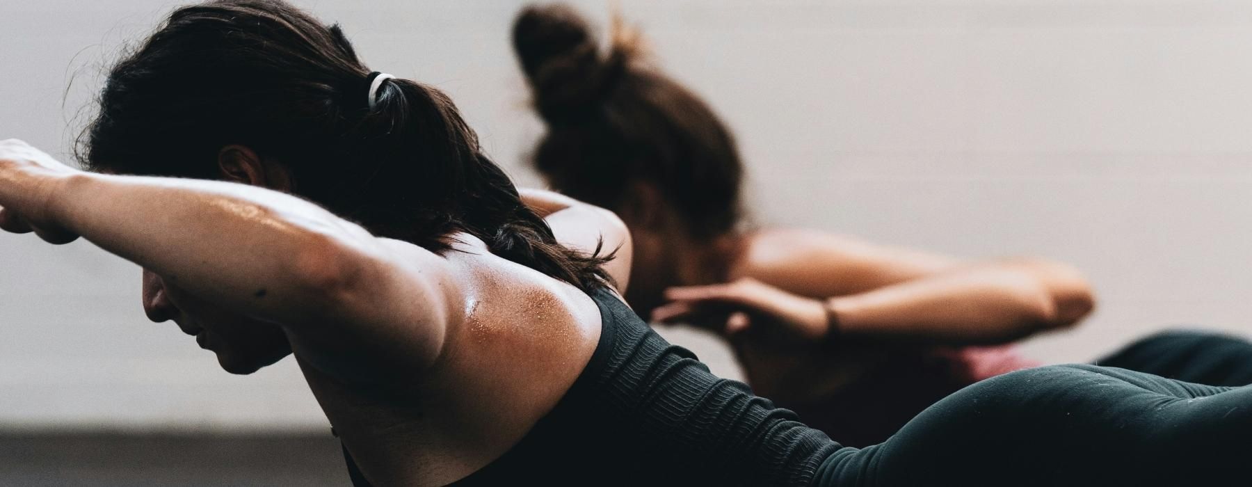 a woman lying on the ground with her head up