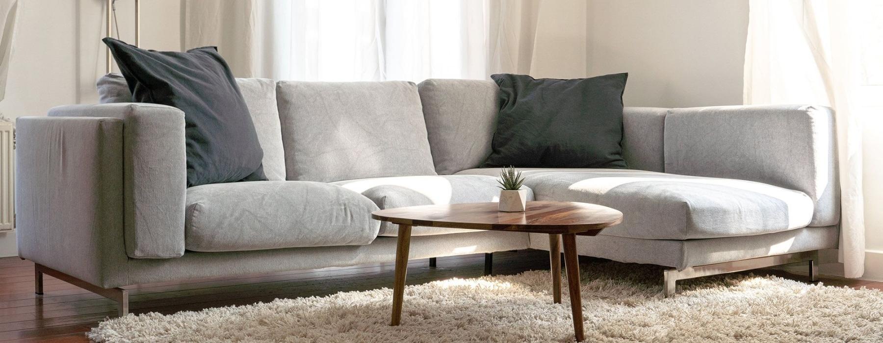 oversized windows brighten spacious, furnished living room